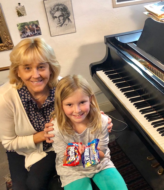 Piano teacher and student